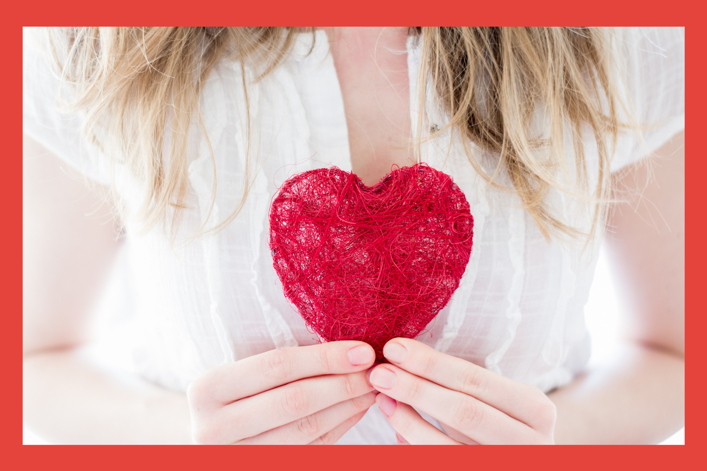 Woman. Red Heart. Close up. 